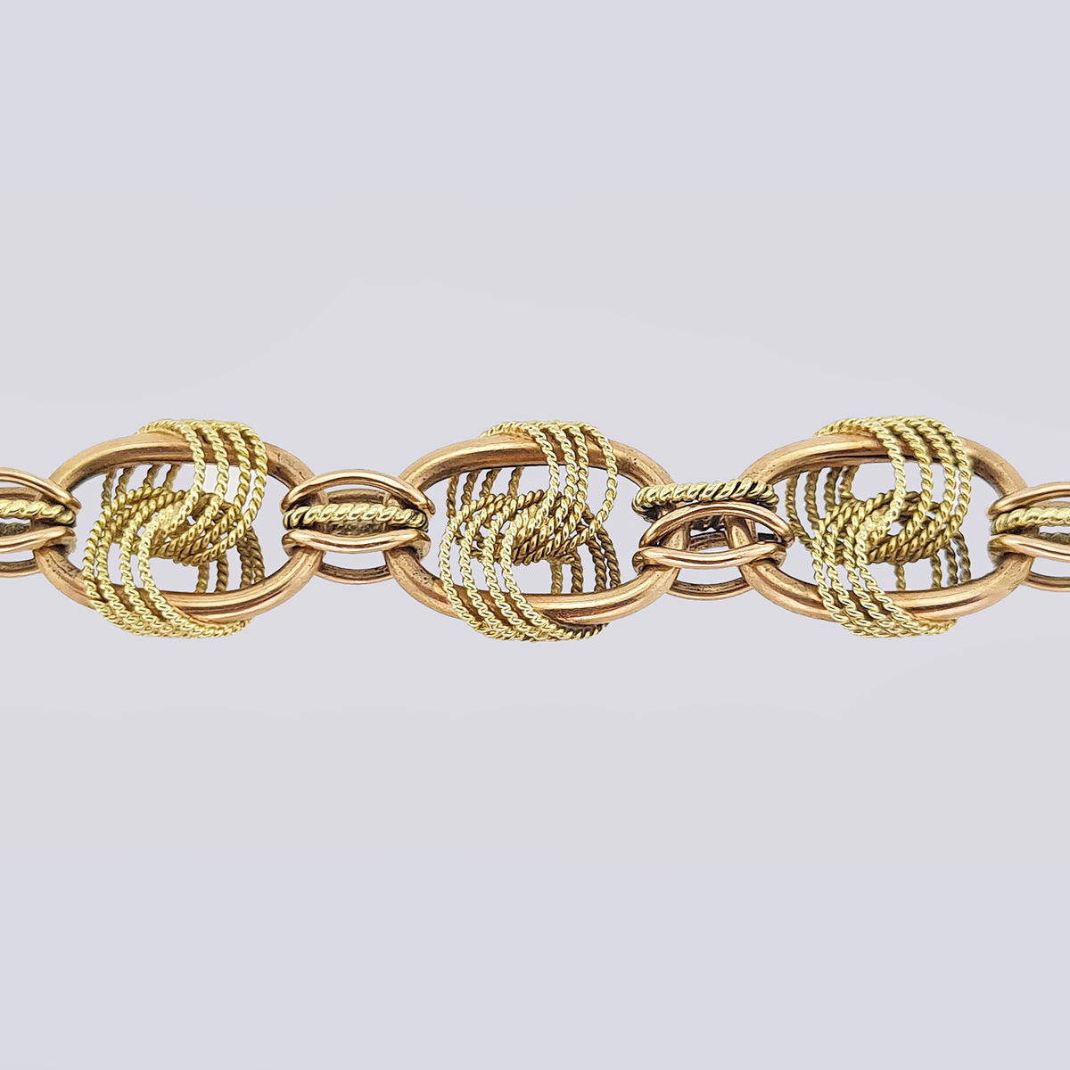 Золотой браслет со сложными узлами из двухцветного золота конца 19 века (21 см, 585 проба)