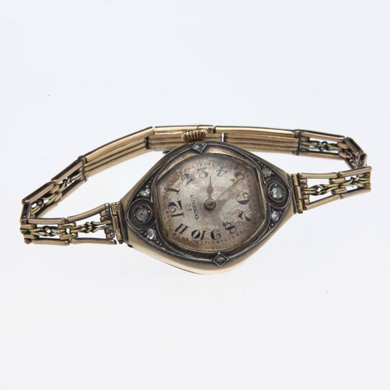 Наручные часы Omega из золота 56 пробы с алмазами 19 века