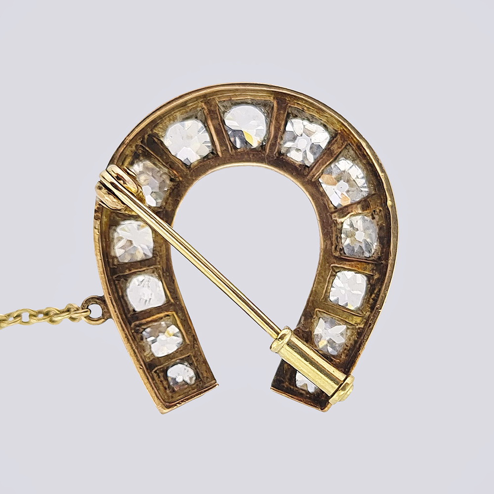 Брошь «Подкова» с бриллиантами и заколкой из золота 56 пробы 19 века