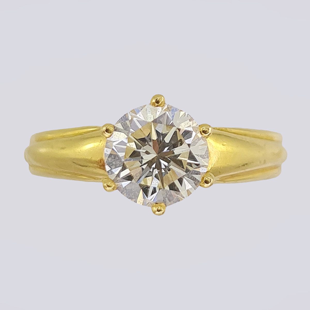 Золотое кольцо 750-й пробы с 1 кр. бр. (16 размер)